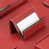 red leather business card holder with white stitching