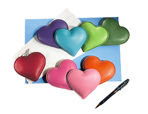heart-shaped paperweights in red, spring, meadow, ocean, azalea, petal, pumpkin and violet leather