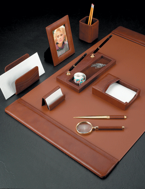 antiqued tan leather desk pad blotter with coordinating leather and gold-plated brass accessories