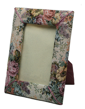 a fabric covered photo frame with an easel stand