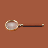 magnifying glass with antique tan leather handle and gold-plated brass frame