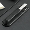 chrome-plated brass scissors and letter opener in a black leather case