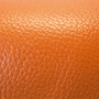 orange pebble-textured leather